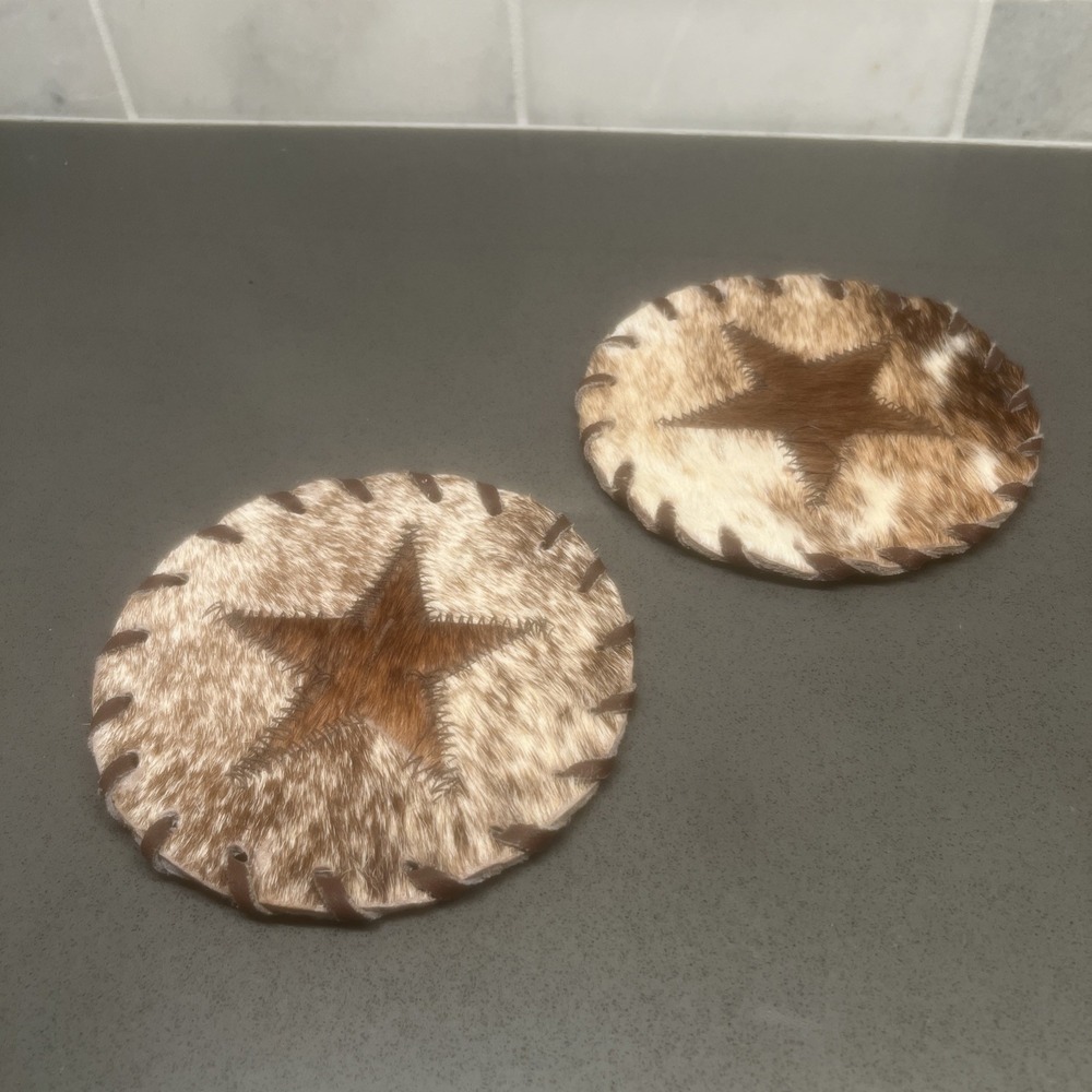 Gaucho Brazil calf hair leather coasters Texas Star, 4 3/4-inch dia. lot of two